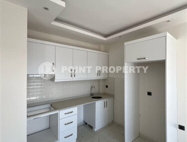 Срочная продажа новой квартиры 1+1 в комплексе с инфраструктурой отельного типа в Махмутларе-id-9907-фото-2