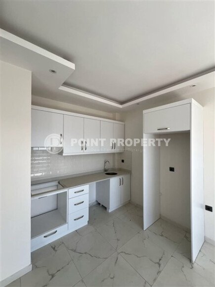 Срочная продажа новой квартиры 1+1 в комплексе с инфраструктурой отельного типа в Махмутларе-id-9907-фото-2