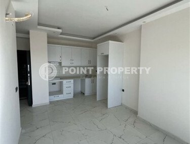 Срочная продажа новой квартиры 1+1 в комплексе с инфраструктурой отельного типа в Махмутларе-id-9907-фото-3