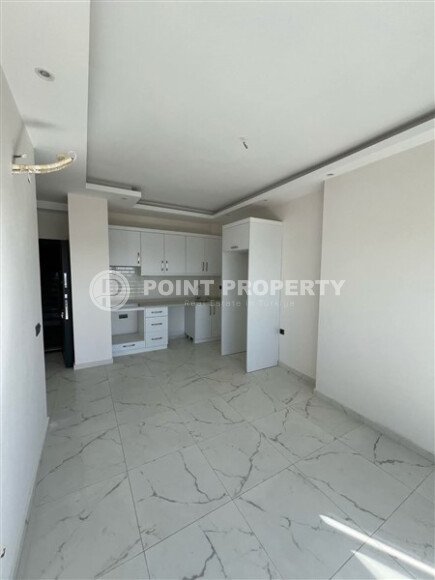 Срочная продажа новой квартиры 1+1 в комплексе с инфраструктурой отельного типа в Махмутларе-id-9907-фото-3