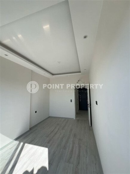 Срочная продажа новой квартиры 1+1 в комплексе с инфраструктурой отельного типа в Махмутларе-id-9907-фото-4