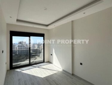 Срочная продажа новой квартиры 1+1 в комплексе с инфраструктурой отельного типа в Махмутларе-id-9907-фото-5