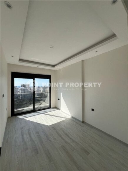 Срочная продажа новой квартиры 1+1 в комплексе с инфраструктурой отельного типа в Махмутларе-id-9907-фото-5