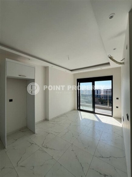 Срочная продажа новой квартиры 1+1 в комплексе с инфраструктурой отельного типа в Махмутларе-id-9907-фото-6