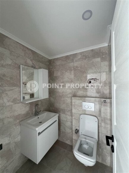 Срочная продажа новой квартиры 1+1 в комплексе с инфраструктурой отельного типа в Махмутларе-id-9907-фото-7