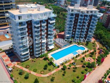 Район Махмутлар. Квартира 2+1, 115 м², 2015 года, до моря 800 м, до центра 500 м, меблирована, с двумя балконами и видом на бассейн.-id-9913-фото-3
