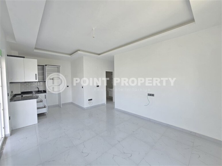 Светлая квартира 1+1 площадью 50 м² с видом на горы в жилом комплексе 2022 года в районе Каргыджак-id-9931-фото-3