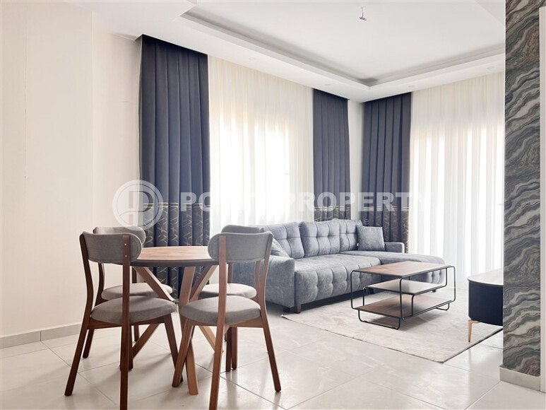Stylish 1+1 apartment of 55 m² furnished in a residential complex of 2023 in Mahmutlar-id-9936-photo-1