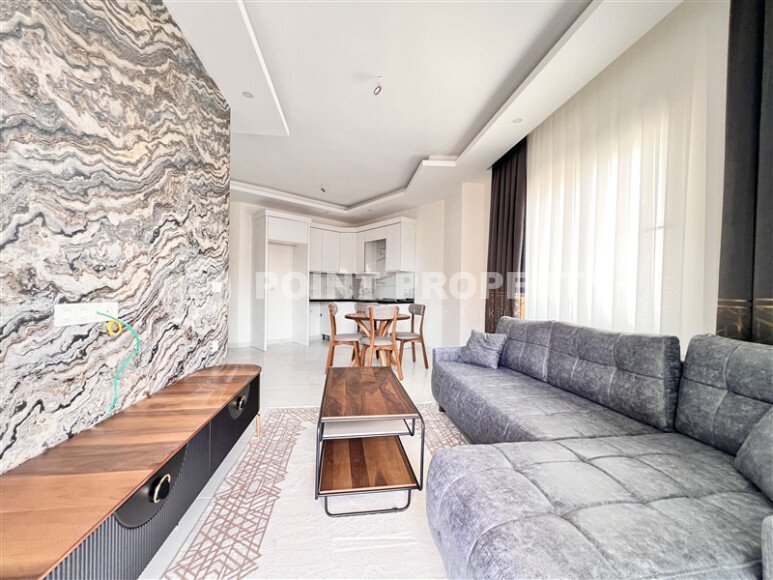Stylish 1+1 apartment of 55 m² furnished in a residential complex of 2023 in Mahmutlar-id-9936-photo-2