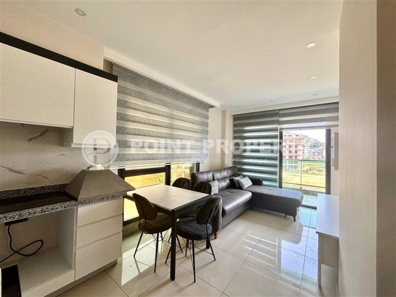 1+1 apartment 55 m² 100 meters from the sea in Kargicak-id-9958-photo-2