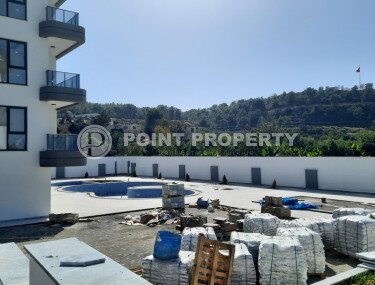 Небольшая двухкомнатная квартира в новом комплексе на финишной стадии строительства, Демирташ, Аланья-id-3353-фото-4