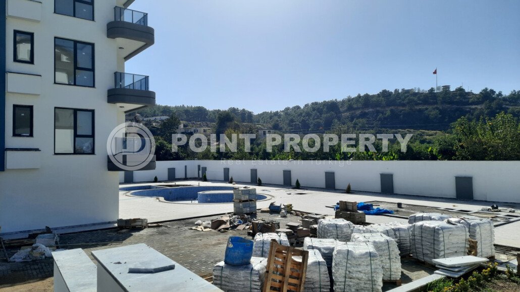 Небольшая двухкомнатная квартира в новом комплексе на финишной стадии строительства, Демирташ, Аланья-id-3353-фото-4