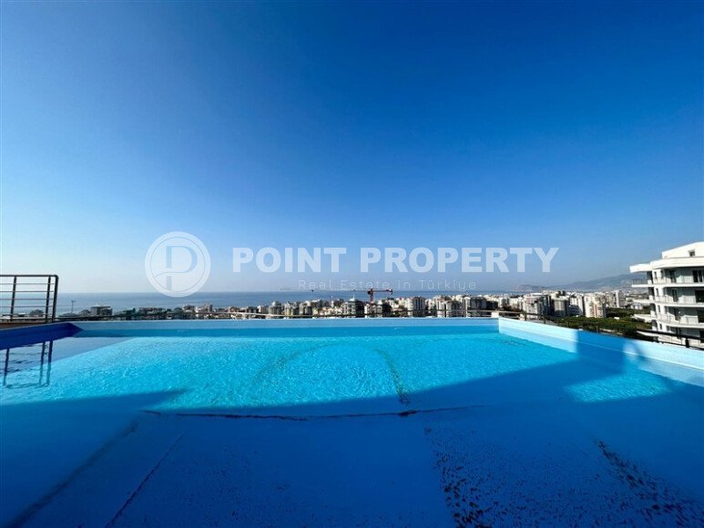 Modern 2+1 apartment with sea view and infinity pool on the roof in Mahmutlar-id-9973-photo-2