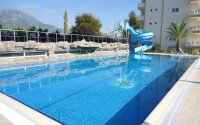 Furnished 2+1 apartment in a complex with a large territory in Mahmutlar-id-9976-photo-1