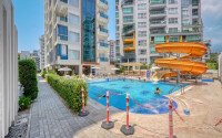 Стильный дуплекс 130 м² с небольшим видом на море в районе Махмутлар-id-9979-фото-1