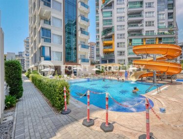 Стильный дуплекс 130 м² с небольшим видом на море в районе Махмутлар-id-9979-фото-1