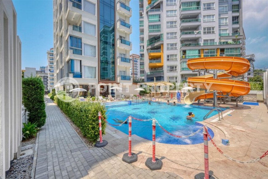 Стильный дуплекс 130 м² с небольшим видом на море в районе Махмутлар-id-9979-фото-1