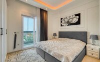 Стильный дуплекс 130 м² с небольшим видом на море в районе Махмутлар-id-9979-фото-5