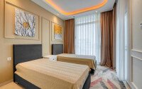 Стильный дуплекс 130 м² с небольшим видом на море в районе Махмутлар-id-9979-фото-6