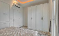 Стильный дуплекс 130 м² с небольшим видом на море в районе Махмутлар-id-9979-фото-7