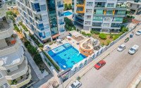 Стильный дуплекс 130 м² с небольшим видом на море в районе Махмутлар-id-9979-фото-12