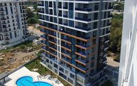 Modern apartment 55 m² in Mahmutlar area with panoramic windows and infrastructure-id-9987-photo-1