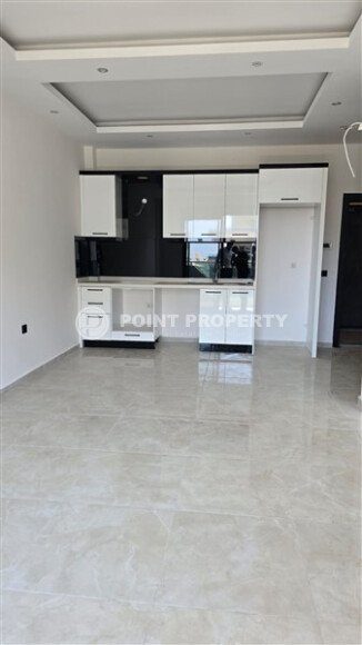 Квартира 1+1 по выгодной цене в новом комплексе района Махмутлар-id-10007-фото-5