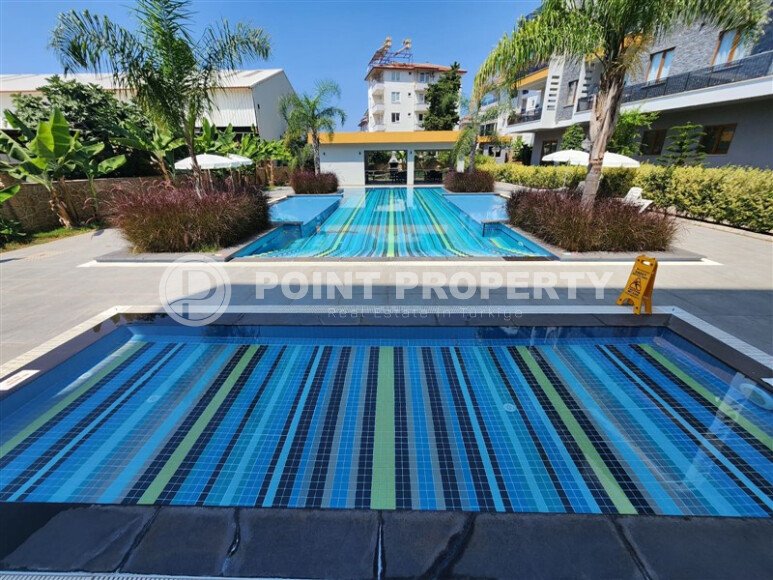 Стильная квартира 2+1 с отдельной кухней и возможностью получения ВНЖ — 110 м² в нижней Оба, Аланья-id-10008-фото-18