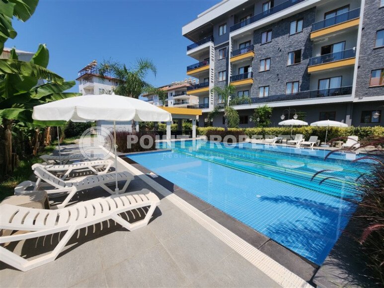 Стильная квартира 2+1 с отдельной кухней и возможностью получения ВНЖ — 110 м² в нижней Оба, Аланья-id-10008-фото-19