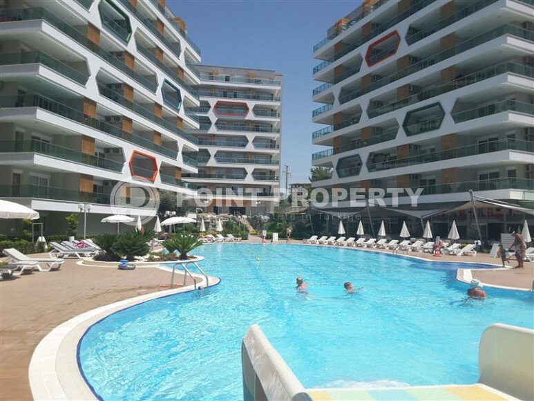 A comfortable 2+1 apartment, 90 m², with a sea view in a large complex, Avsallar district-id-10174-photo-1