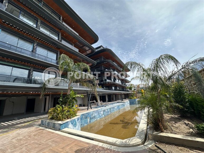Investment project at the initial stage of construction in the center of Alanya, views of the sea, mountains and Alanya fortress-id-1066-photo-1