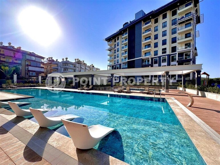 Elegant 2+1 apartment, 96 m² in the center of Alanya in the Cleopatra area with indoor parking and a residence permit-id-10217-photo-1