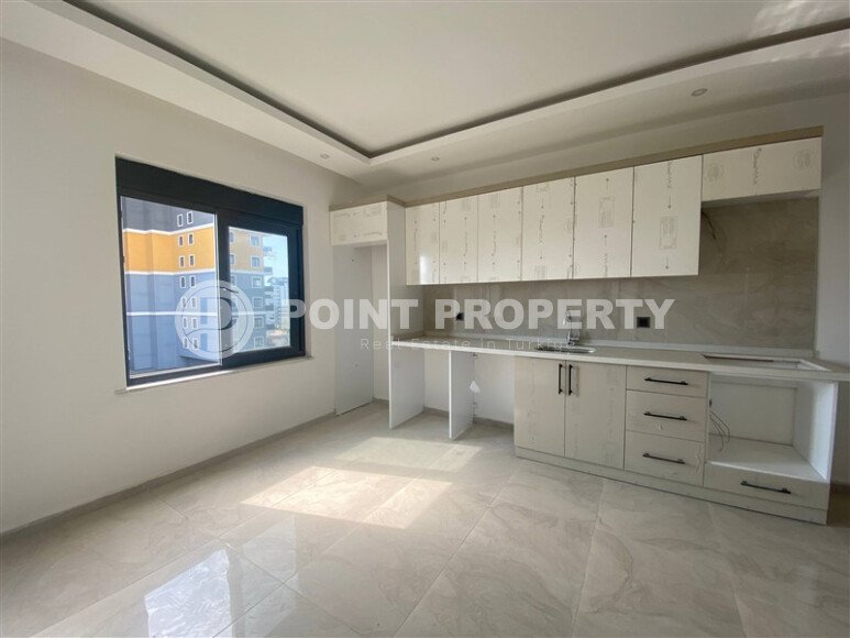 New bright 1+1 apartment of 50 m² in a modern residential complex with a swimming pool and partial sea view in Mahmutlar-id-10228-photo-1