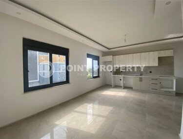 New bright 1+1 apartment of 50 m² in a modern residential complex with a swimming pool and partial sea view in Mahmutlar-id-10228-photo-2