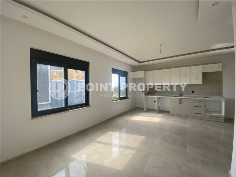 New bright 1+1 apartment of 50 m² in a modern residential complex with a swimming pool and partial sea view in Mahmutlar-id-10228-photo-2