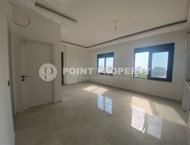 New bright 1+1 apartment of 50 m² in a modern residential complex with a swimming pool and partial sea view in Mahmutlar-id-10228-photo-4