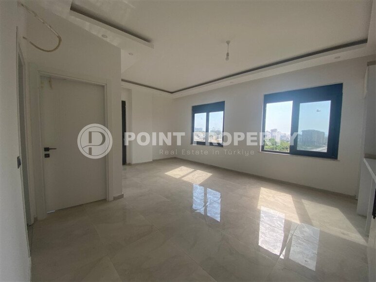 New bright 1+1 apartment of 50 m² in a modern residential complex with a swimming pool and partial sea view in Mahmutlar-id-10228-photo-4