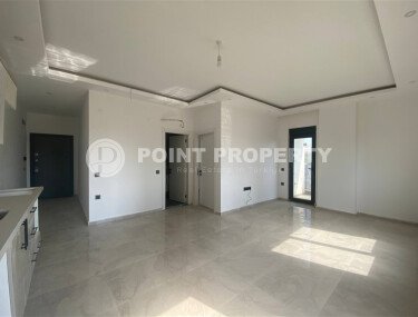 New bright 1+1 apartment of 50 m² in a modern residential complex with a swimming pool and partial sea view in Mahmutlar-id-10228-photo-5