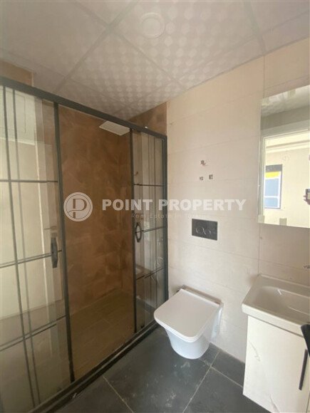 New bright 1+1 apartment of 50 m² in a modern residential complex with a swimming pool and partial sea view in Mahmutlar-id-10228-photo-6