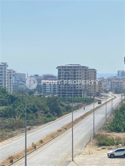 New bright 1+1 apartment of 50 m² in a modern residential complex with a swimming pool and partial sea view in Mahmutlar-id-10228-photo-8