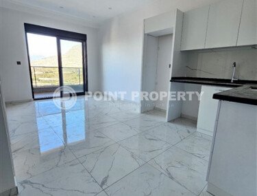 Просторная квартира 1+1 площадью 59 м² с видом на море и горы в комплексе комфорт-класса в Махмутларе-id-10229-фото-2