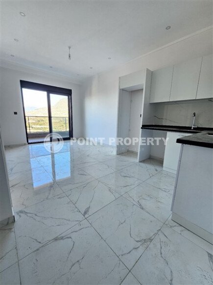 Просторная квартира 1+1 площадью 59 м² с видом на море и горы в комплексе комфорт-класса в Махмутларе-id-10229-фото-2