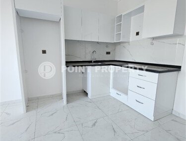 Просторная квартира 1+1 площадью 59 м² с видом на море и горы в комплексе комфорт-класса в Махмутларе-id-10229-фото-3