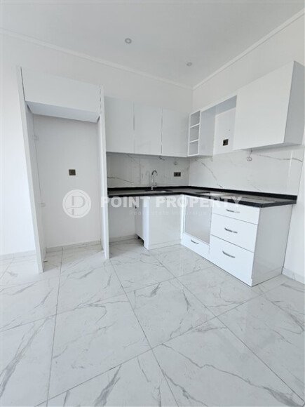 Просторная квартира 1+1 площадью 59 м² с видом на море и горы в комплексе комфорт-класса в Махмутларе-id-10229-фото-3