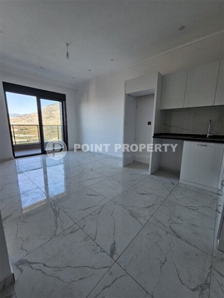 Просторная квартира 1+1 площадью 59 м² с видом на море и горы в комплексе комфорт-класса в Махмутларе-id-10229-фото-4