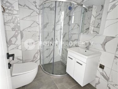 Просторная квартира 1+1 площадью 59 м² с видом на море и горы в комплексе комфорт-класса в Махмутларе-id-10229-фото-5