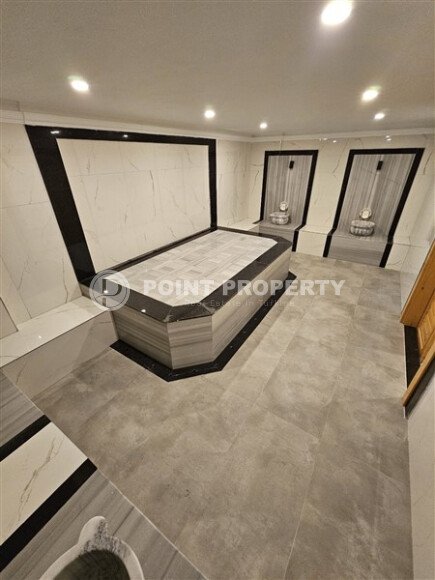 Просторная квартира 1+1 площадью 59 м² с видом на море и горы в комплексе комфорт-класса в Махмутларе-id-10229-фото-9