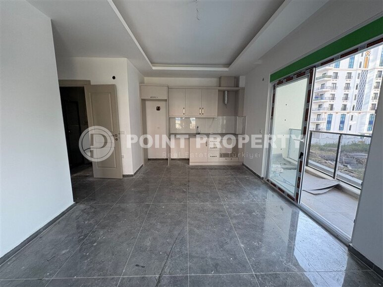 A cozy and bright 1+1 apartment of 54 m² in a new residential complex with green infrastructure in Mahmutlar-id-10235-photo-3