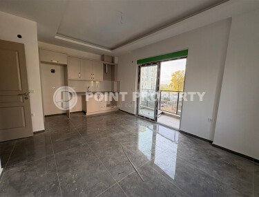 Уютная и светлая квартира 1+1 площадью 54 м² в новом жилом комплексе с зелёной инфраструктурой в Махмутларе-id-10235-фото-4