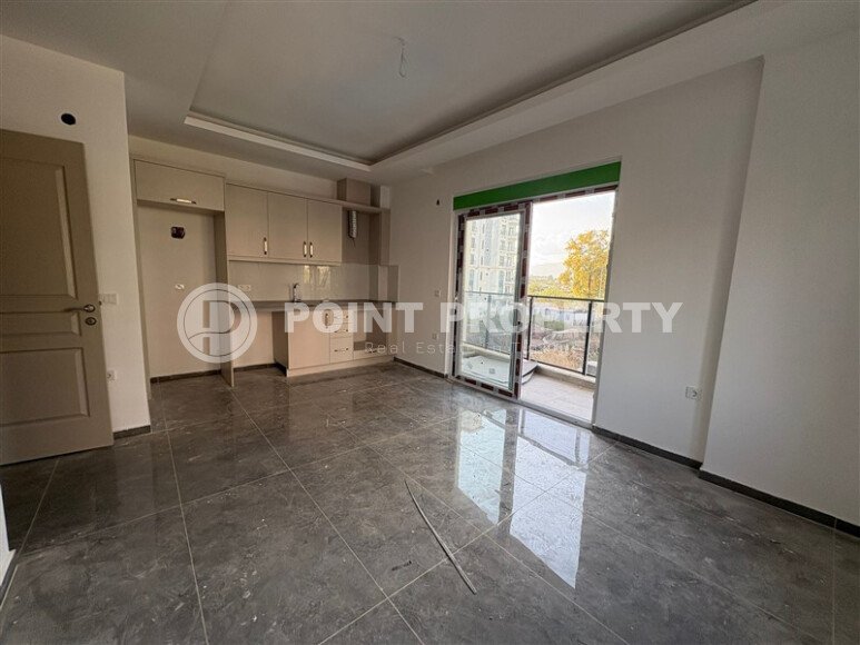 A cozy and bright 1+1 apartment of 54 m² in a new residential complex with green infrastructure in Mahmutlar-id-10235-photo-4